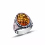 Silver ring with amber stone, crescent and star